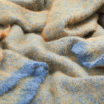A representation of crumpled Ochre Clash Mohair Throw Blanket